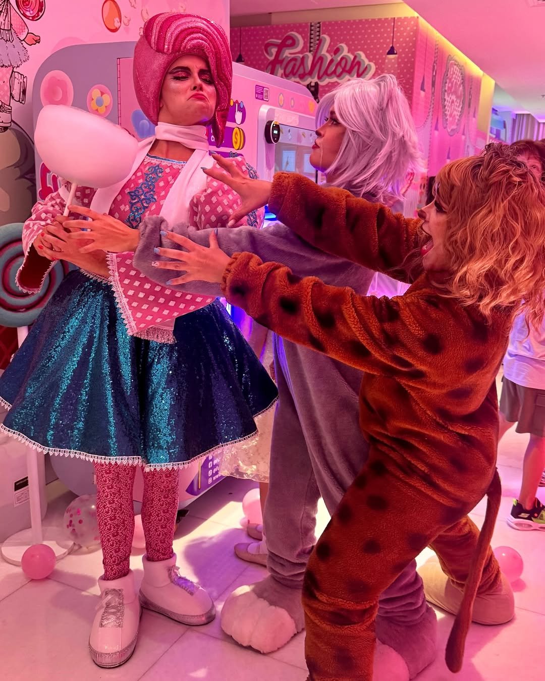 Little girl enjoying fresh cotton candy at a children's birthday party with the Funland Vending machine, UAE